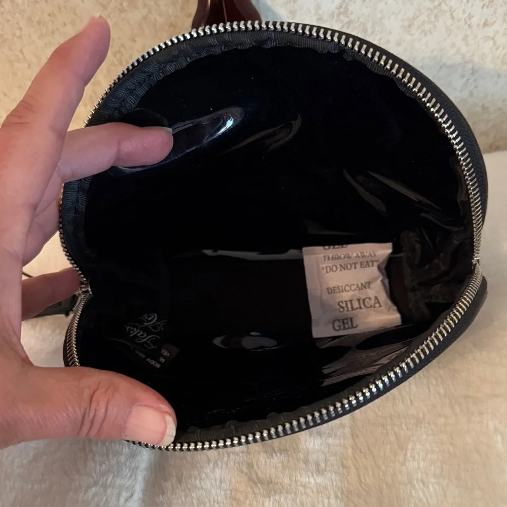 Saks Fifth Avenue Black Patent Cosmetic Pouch with White Bow Print